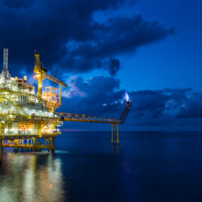 Panorama of oil and gas central processing platform in sun set