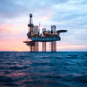 Offshore Jack Up Rig in The Middle of The Sea at Sunset Time