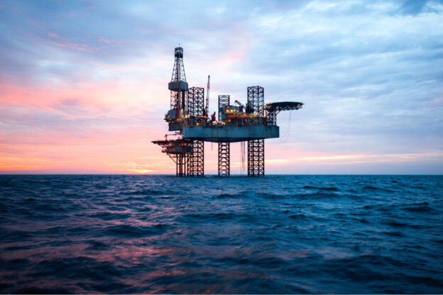 Offshore Jack Up Rig in The Middle of The Sea at Sunset Time