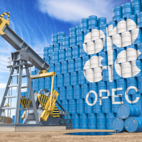 Oil pump jack and oil barrels with OPEC flag.