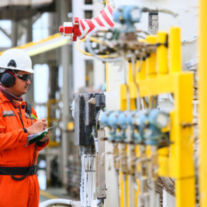 Oil & Gas Worker Checking Pipes