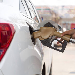 Person Filling Up Their Gas Tank In Texas