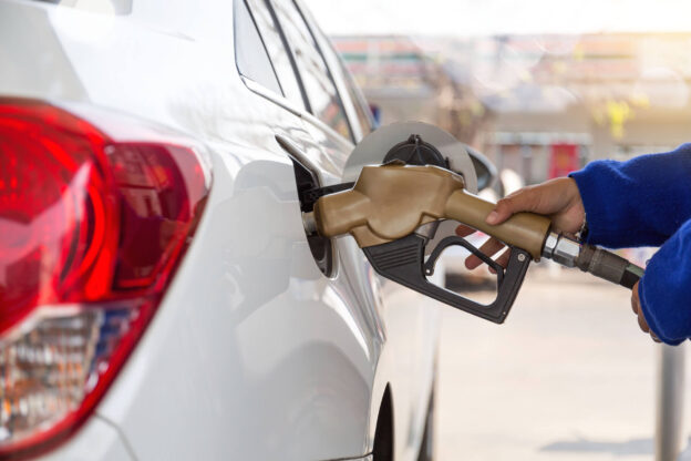 Person Filling Up Their Gas Tank In Texas